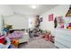 Cozy bedroom featuring a daybed, toys, and a carpeted floor at 1819 Wild Grain Ave, North Las Vegas, NV 89086