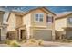Charming two-story home with a neutral color palette, a two-car garage, and low-maintenance landscaping at 1819 Wild Grain Ave, North Las Vegas, NV 89086