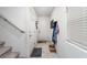 Hallway with white walls, stairs, a door and a cozy doormat at 1819 Wild Grain Ave, North Las Vegas, NV 89086