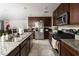 Spacious kitchen features granite countertops, stainless steel appliances, and modern cabinetry at 1819 Wild Grain Ave, North Las Vegas, NV 89086