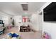Bright upstairs living area featuring a large TV and carpet flooring at 1819 Wild Grain Ave, North Las Vegas, NV 89086