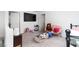 Upstairs living area with a large TV, seating and carpet flooring at 1819 Wild Grain Ave, North Las Vegas, NV 89086