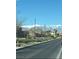 Street view with desert landscaping and mountain views offering an inviting neighborhood atmosphere at 1819 Wild Grain Ave, North Las Vegas, NV 89086