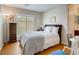 Comfortable bedroom boasting wood floors, a window with shutters, and a stylish writing desk at 1973 Ardilea St, Las Vegas, NV 89135