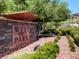 The West Park monument sign is surrounded by lush landscaping at 1973 Ardilea St, Las Vegas, NV 89135