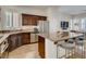 Well-equipped kitchen with granite countertops, stainless steel appliances, and a large island with seating, ideal for entertaining at 1973 Ardilea St, Las Vegas, NV 89135