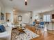 Open-concept living space with a view of the dining area, featuring wood floors and contemporary furniture at 1973 Ardilea St, Las Vegas, NV 89135