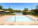 Community pool with lounge chairs and umbrellas providing a relaxing summer spot at 1973 Ardilea St, Las Vegas, NV 89135
