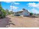 Exterior view of the home from the backyard, showing the structure and surrounding landscape at 2012 Wendell Ave, Las Vegas, NV 89101