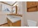 Bathroom featuring a single sink vanity with white countertops and patterned wallpaper at 2012 Wendell Ave, Las Vegas, NV 89101