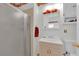 Bathroom with a shower, and a mirror with decorative accents above a single sink at 2012 Wendell Ave, Las Vegas, NV 89101