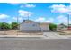 Cozy single-story home with a driveway, garage and chain link fence for security at 2012 Wendell Ave, Las Vegas, NV 89101