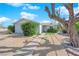 Nice single-story home with a sidewalk leading to the front door and desert landscaping at 2012 Wendell Ave, Las Vegas, NV 89101