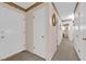 Hallway with neutral walls and doors to various rooms, including bedrooms and bathrooms at 2012 Wendell Ave, Las Vegas, NV 89101