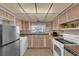Bright kitchen with a stainless steel refrigerator, white appliances, and ample cabinetry at 2012 Wendell Ave, Las Vegas, NV 89101