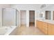Bathroom featuring double sinks, separate shower, and soaking tub at 2052 Powder Springs St, Henderson, NV 89052
