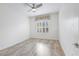 Bright bedroom with light hardwood floors, ceiling fan and large window at 2052 Powder Springs St, Henderson, NV 89052