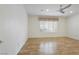 Spacious bedroom with light hardwood floors, ceiling fan and bright window at 2052 Powder Springs St, Henderson, NV 89052