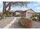Charming single-story home with desert landscaping, front walkway, and a two-car garage at 2052 Powder Springs St, Henderson, NV 89052