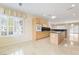 Bright eat-in kitchen featuring wood cabinets, an island and stainless steel appliances at 2052 Powder Springs St, Henderson, NV 89052