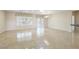 Bright living room with tile floors, large windows, and sliding glass door at 2052 Powder Springs St, Henderson, NV 89052