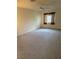 Spacious bedroom featuring carpet, a ceiling fan and good natural light from the window at 221 Oro Canyon St, Henderson, NV 89074