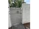 Gated entrance with block wall and desert landscaping accents at 221 Oro Canyon St, Henderson, NV 89074