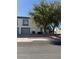 Charming townhome featuring a well-maintained lawn and a neutral color palette at 221 Oro Canyon St, Henderson, NV 89074
