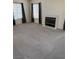 Spacious living room with a fireplace and natural light at 221 Oro Canyon St, Henderson, NV 89074