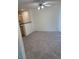 Open living area with neutral carpet and ceiling fan at 221 Oro Canyon St, Henderson, NV 89074