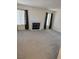 Bright living room with large windows and a cozy fireplace at 221 Oro Canyon St, Henderson, NV 89074