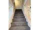 Carpeted staircase leading to the upper level, featuring painted railings, ready for personalization at 221 Oro Canyon St, Henderson, NV 89074