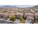 Stunning aerial view of a residential neighborhood featuring well-maintained homes and scenic mountain vistas at 231 Pioneers Peak Ave, Henderson, NV 89002