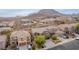 Scenic aerial view of a charming community with houses surrounded by picturesque mountain scenery at 231 Pioneers Peak Ave, Henderson, NV 89002