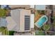 Aerial view of home with solar panels, pool and well-manicured backyard at 231 Pioneers Peak Ave, Henderson, NV 89002