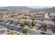 Aerial view showcasing the beautiful homes in the neighborhood with stunning mountain views in the background at 231 Pioneers Peak Ave, Henderson, NV 89002
