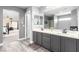Bathroom vanity with double sinks and view of the soaking tub and bedroom at 231 Pioneers Peak Ave, Henderson, NV 89002