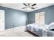 Blue bedroom featuring a bed and large window at 231 Pioneers Peak Ave, Henderson, NV 89002