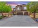 Charming two-story home with a well-maintained front yard and a spacious three-car garage at 231 Pioneers Peak Ave, Henderson, NV 89002