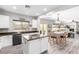 Bright kitchen featuring stainless steel appliances, dark hardware, and barstool seating at 231 Pioneers Peak Ave, Henderson, NV 89002