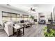 Spacious living room with hardwood floors, a cozy fireplace, and comfortable seating at 231 Pioneers Peak Ave, Henderson, NV 89002