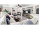 Open-concept living room featuring recessed lighting, stylish decor, and comfortable sectional sofa at 231 Pioneers Peak Ave, Henderson, NV 89002