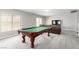 Open loft area featuring a billiard table, comfortable seating, and lots of natural light at 231 Pioneers Peak Ave, Henderson, NV 89002