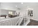 Bright loft area with white railing overlooking a cozy living space with a pool table at 231 Pioneers Peak Ave, Henderson, NV 89002