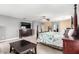 Large main bedroom showcasing a king-size bed, ceiling fan, and decorative furniture at 231 Pioneers Peak Ave, Henderson, NV 89002