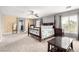 Spacious main bedroom featuring a ceiling fan, gray walls, and lots of natural light at 231 Pioneers Peak Ave, Henderson, NV 89002