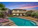 Inviting backyard pool with lounge chairs, perfect for relaxation and entertaining at 231 Pioneers Peak Ave, Henderson, NV 89002