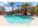 Inviting backyard featuring a refreshing pool, waterfall feature, lush landscaping, and lounge chairs at 231 Pioneers Peak Ave, Henderson, NV 89002