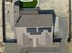 An aerial view reveals a modern home with solar panels, pool, and well-maintained landscaping at 2330 Deadwood St, Pahrump, NV 89048