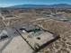 Captured from above, the property showcases a desert landscape, a fenced-in yard with a pool, and a secondary outbuilding at 2330 Deadwood St, Pahrump, NV 89048